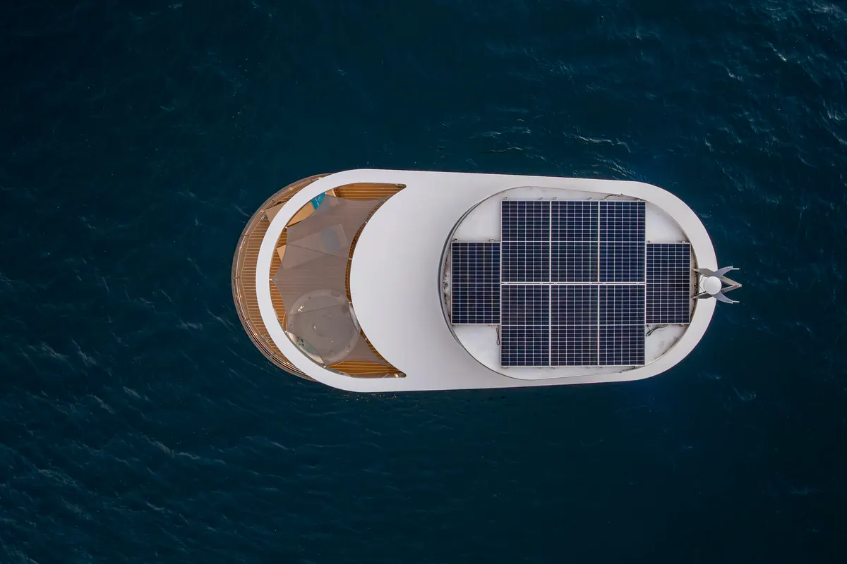 Amor from directly above, its roof covered by a solar array